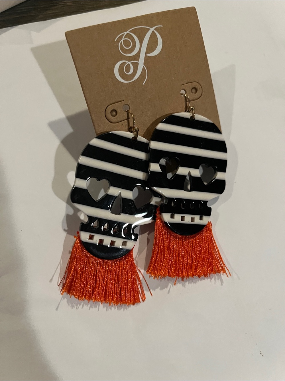 Plunder Black & White Striped Skull Earrings with Orange Tassels